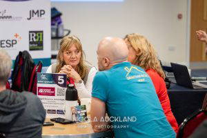 3 people around a table networking